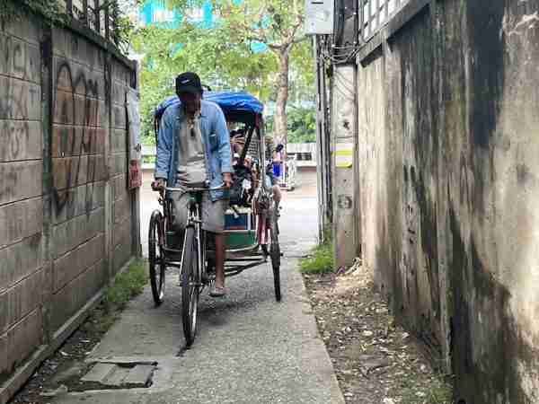 Bicycle taxi in an alley