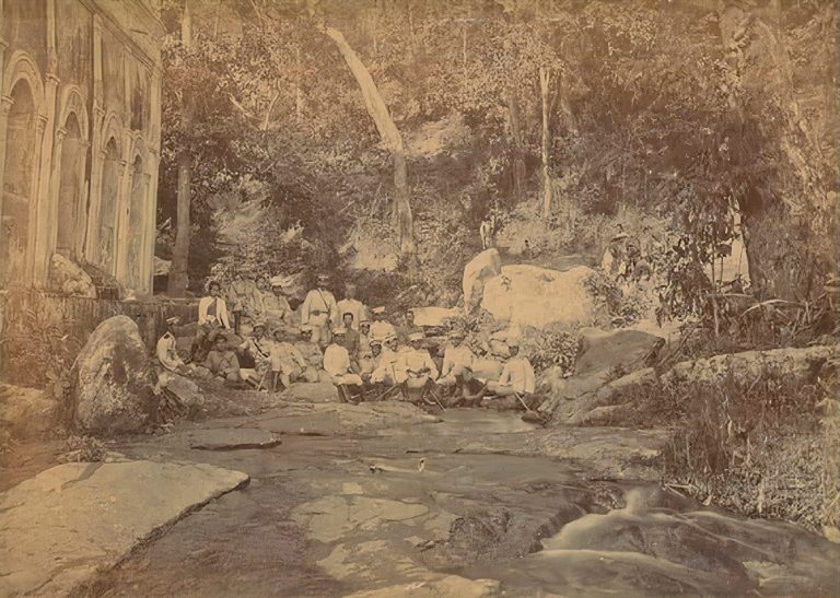 A group of people at a temple Wat Pha Lat