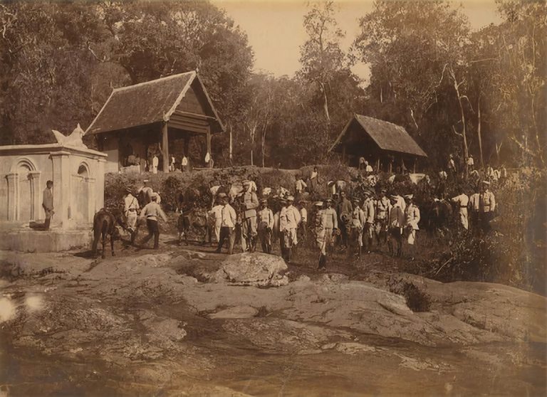 A group of people at a temple Wat Pha Lat
